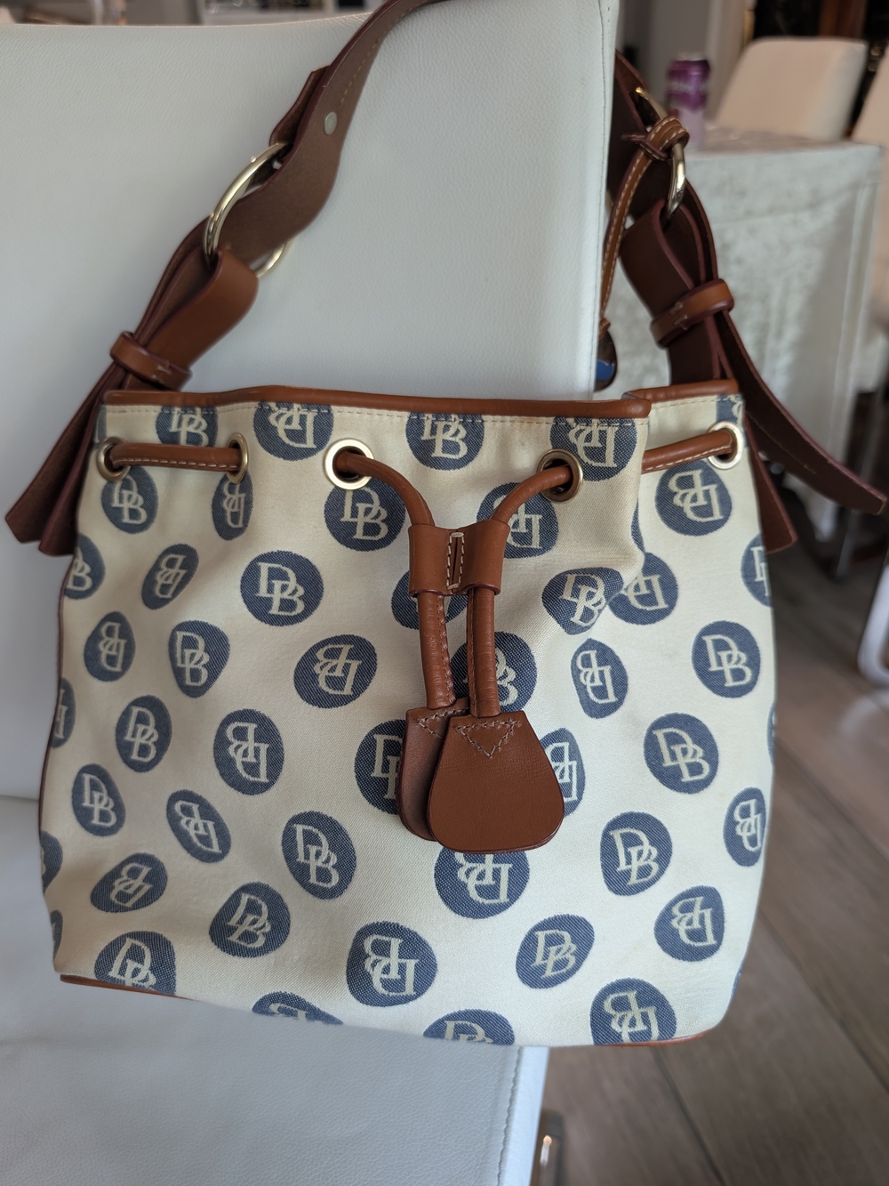 Dooney & Bourke Cream Canvas DB Logo Drawstring Shoulder Bag with Brown Trim